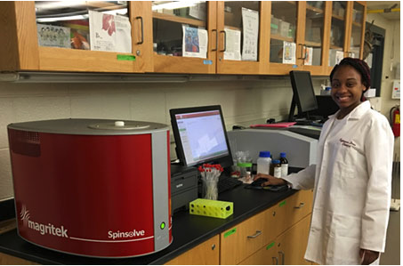 Undergraduate chemistry major, Tytianna Drew, uses the Magritek Spinsolve benchtop NMR spectrometer